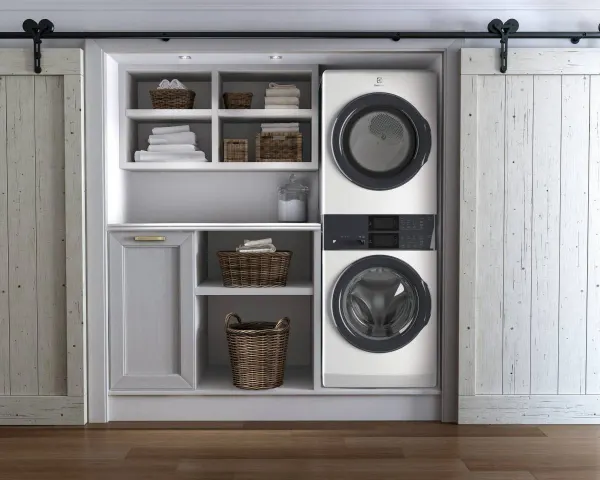 An Electrolux washer and dryer tower in a laundry room