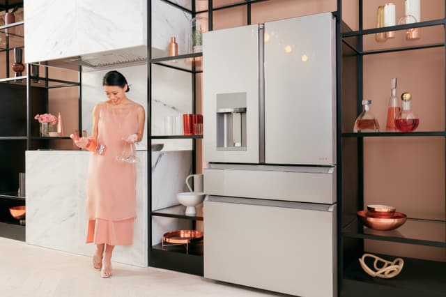 Front view of a modern kitchen with a Cafe refrigerator