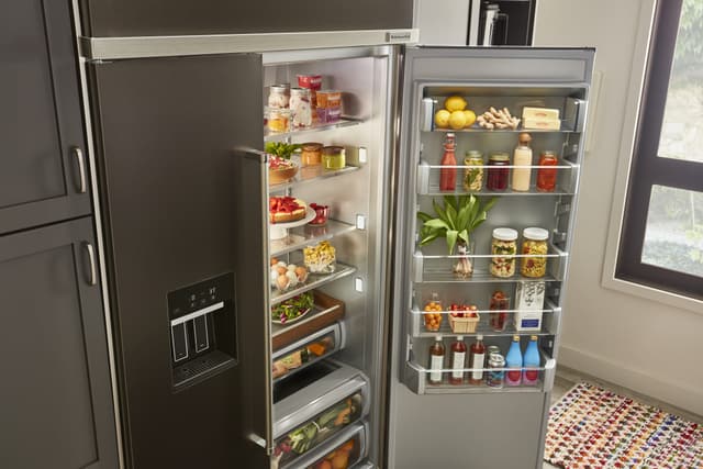 Close view of a side by side KitchenAid refrigerator