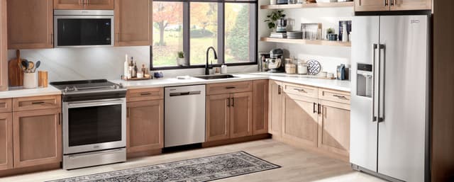 Front view of a modern kitchen with Maytag appliances Front view of a modern kitchen with Maytag appliances